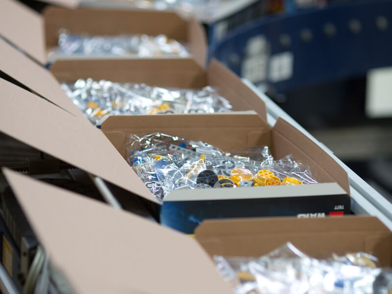 Boxes of LEGO on a packaging line